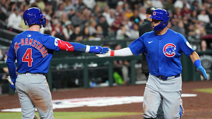Mar 27, 2025; Phoenix, Arizona, USA; Chicago Cubs outfielder Seiya Suzuki (27) slaps hands with Chicago Cubs outfielder Pete Crow-Armstrong (4) after scoring a run against the Arizona Diamondbacks during the sixth inning at Chase Field. Mar 27, 2025; Phoenix, Arizona, USA; Chicago Cubs outfielder Seiya Suzuki (27) slaps hands with Chicago Cubs outfielder Pete Crow-Armstrong (4) after scoring a run against the Arizona Diamondbacks during the sixth inning at Chase Field.