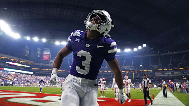 Kansas State running back Dylan Edwards (3) celebrates the go-ahead touchdown against Rutgers during the second half of the Rate Bowl at Chase Field on Dec. 26, 2024, in Phoenix.