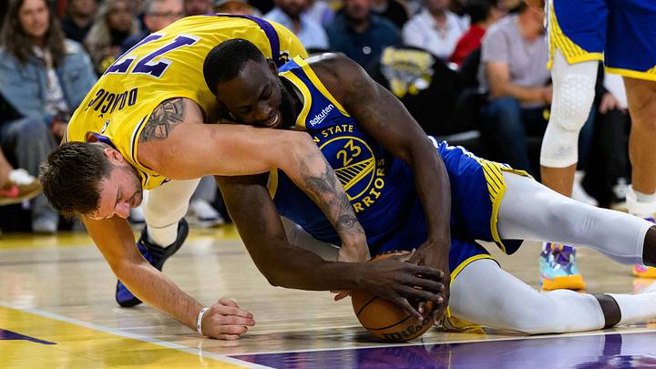 Oct 21, 2025; Los Angeles, California, USA; Golden State Warriors forward Draymond Green (23) and Los Angeles Lakers guard Luka Doncic (77) fight for the ball during the first half at Crypto.com Arena. Mandatory Credit: William Liang-Imagn Images Oct 21, 2025; Los Angeles, California, USA; Golden State Warriors forward Draymond Green (23) and Los Angeles Lakers guard Luka Doncic (77) fight for the ball during the first half at Crypto.com Arena. Mandatory Credit: William Liang-Imagn Images