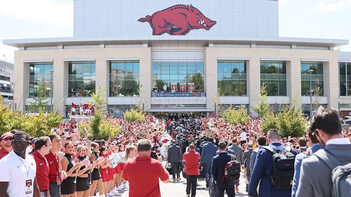 Arkansas Razorbacks football team reach the stadium during the Hog Walk prior to the game against the UAB Blazers at Razorback Stadium.