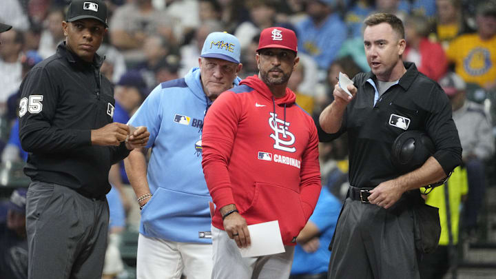 Sep 12, 2025; Milwaukee, Wisconsin, USA; Milwaukee Brewers manager Pat Murphy (49) and St. Louis Cardinals manager Oliver Marmol (37) go over the parameters of the playing field with home plate umpire Hanahan before their game at American Family Field. Also pictured is third base umpire Jeramie Rehak. Mandatory Credit: Michael McLoone-Imagn Images Sep 12, 2025; Milwaukee, Wisconsin, USA; Milwaukee Brewers manager Pat Murphy (49) and St. Louis Cardinals manager Oliver Marmol (37) go over the parameters of the playing field with home plate umpire Hanahan before their game at American Family Field. Also pictured is third base umpire Jeramie Rehak. Mandatory Credit: Michael McLoone-Imagn Images