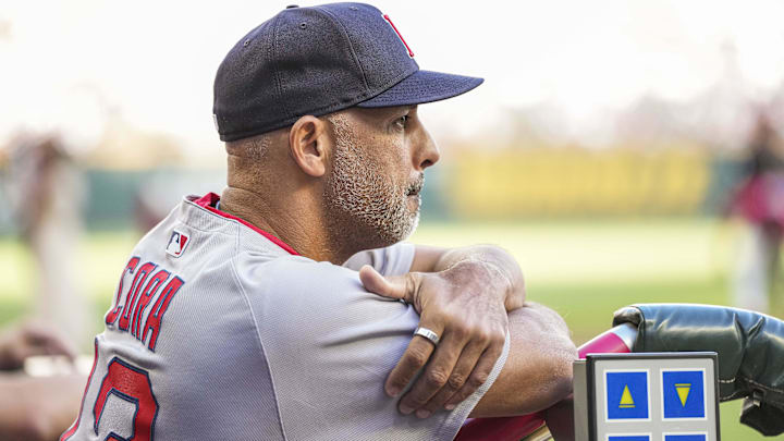 Boston Red Sox manager Alex Cora (13) in the dugout against the Atlanta Braves during the first inning at Truist Park.
