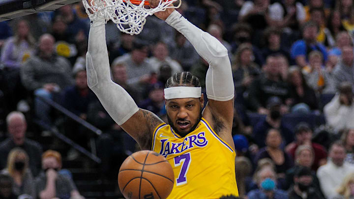 Dec 17, 2021; Minneapolis, Minnesota, USA; Los Angeles Lakers forward Carmelo Anthony (7) dunks against the Minnesota Timberwolves in the second quarter at Target Center. Mandatory Credit: Brad Rempel-Imagn Images