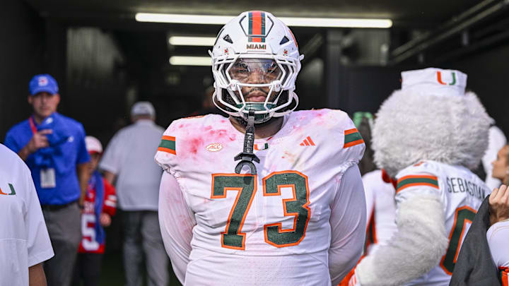 Nov 1, 2025; Dallas, Texas, USA;  Miami Hurricanes offensive lineman Anez Cooper (73) looks on from the tunnel as the SMU Mustangs celebrate the victory over the Hurricanes during the overtime period  at Gerald J. Ford Stadium. Mandatory Credit: Jerome Miron-Imagn Images