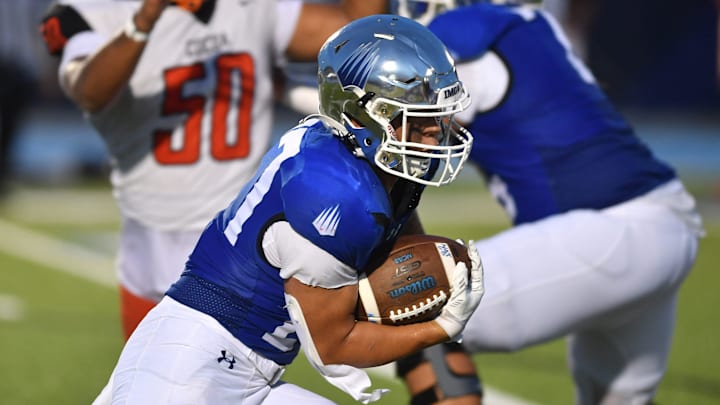 IMG Academy running back Tyson Park (#27) finds a hole in the Cocoa High defense. The IMG Academy National squad hosted the Cocoa High School Tigers Friday, Sept. 6, 2024 in Bradenton.