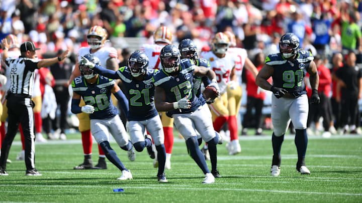 Seattle Seahawks linebacker Ernest Jones IV (13) celebrates after a play during the second half