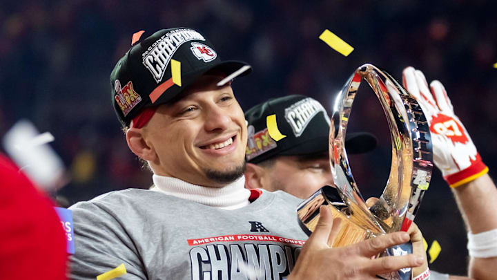 Jan 26, 2025; Kansas City, MO, USA; Kansas City Chiefs quarterback Patrick Mahomes celebrates with the Lamar Hunt Trophy after defeating the Buffalo Bills during the AFC Championship game at GEHA Field at Arrowhead Stadium. Mandatory Credit: Mark J. Rebilas-Imagn Images