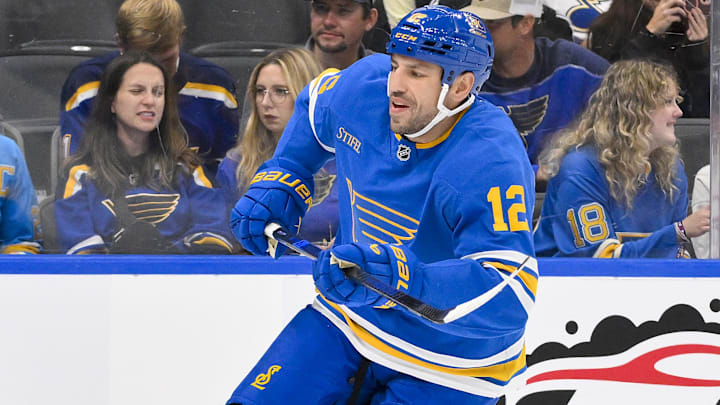 Oct 2, 2025; St. Louis, Missouri, USA; St. Louis Blues left wing Milan Lucic (12) skates against the Ottawa Senators during the second period at Enterprise Center. Mandatory Credit: Jeff Curry-Imagn Images