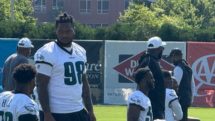 Jalen Carter talks with teammatae Nakobe Dean before Day 2 of Eagles training camp. Both players are battling injuries. Jalen Carter talks with teammatae Nakobe Dean before Day 2 of Eagles training camp. Both players are battling injuries.