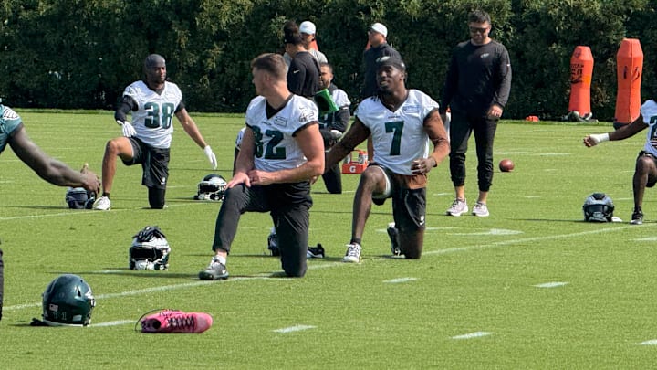 Reed Blankenship (32) and Kelee Ringo (7) go through a stretching drill during a Week 5 practice.