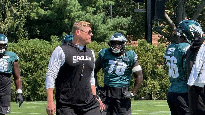 Eagles first-year offensive line coach Chris Kuper works with his lineman during practice on Aug. 24, 2026.