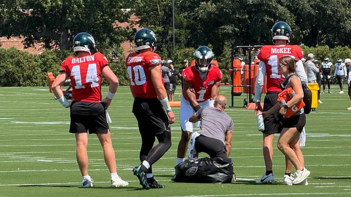 Eagles quarterbacks (left to right) Andy Dalton, Cole Payton, Jalen Hurts, and Tanner McKee work through a drill during training camp in 2026. Eagles quarterbacks (left to right) Andy Dalton, Cole Payton, Jalen Hurts, and Tanner McKee work through a drill during training camp in 2026.