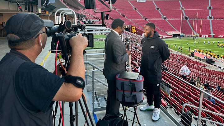 Dorsey football coach Stafon Johnson, former USC running back, does interview with Jim Hill at the Los Angeles Memorial Coliseum.
