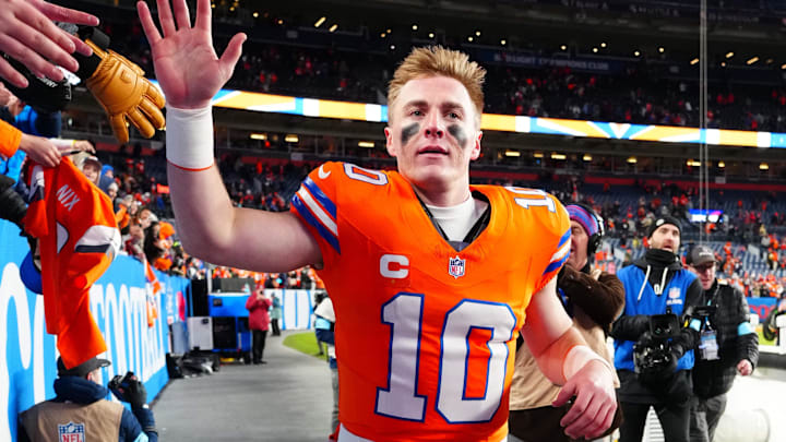 Jan 5, 2025; Denver, Colorado, USA; Denver Broncos quarterback Bo Nix (10) following the win against the Kansas City Chiefs at Empower Field at Mile High. Mandatory Credit: Ron Chenoy-Imagn Images