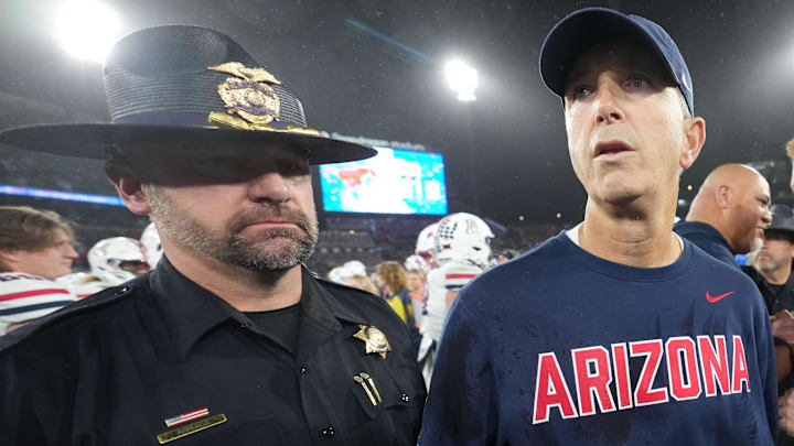 Jan 2, 2026; San Diego, CA, USA; Arizona Wildcats head coach Brent Brennan reacts after shaking hands with SMU Mustangs head coach Rhett Lashlee in the Holiday Bowl at Snapdragon Stadium. Mandatory Credit: Kirby Lee-Imagn Images