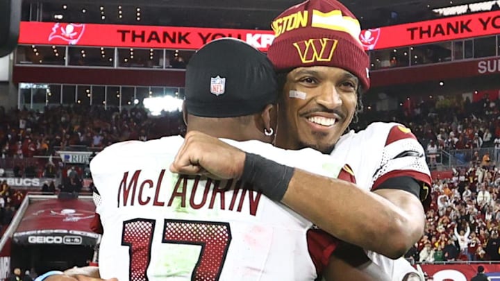 Jan 12, 2025; Tampa, Florida, USA; Washington Commanders quarterback Jayden Daniels (5) celebrates with wide receiver Terry McLaurin (17) after winning a NFC wild card playoff against the Tampa Bay Buccaneers at Raymond James Stadium. Mandatory Credit: Kim Klement Neitzel-Imagn Images Jan 12, 2025; Tampa, Florida, USA; Washington Commanders quarterback Jayden Daniels (5) celebrates with wide receiver Terry McLaurin (17) after winning a NFC wild card playoff against the Tampa Bay Buccaneers at Raymond James Stadium. Mandatory Credit: Kim Klement Neitzel-Imagn Images
