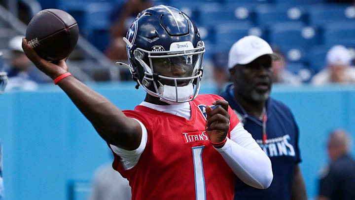 Tennessee Titans quarterback Cam Ward (1) passes during “Back Together Weekend” training camp practice at Nissan Stadium Saturday, July 26, 2025, in Nashville, Tenn.