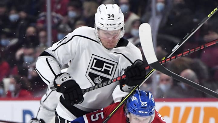 Nov 9, 2021; Montreal, Quebec, CAN; Los Angeles Kings forward Arthur Kaliyev (34) checks Montreal Canadiens forward Michael Pezetta (55) during the first period at the Bell Centre. Mandatory Credit: Eric Bolte-USA TODAY Sports