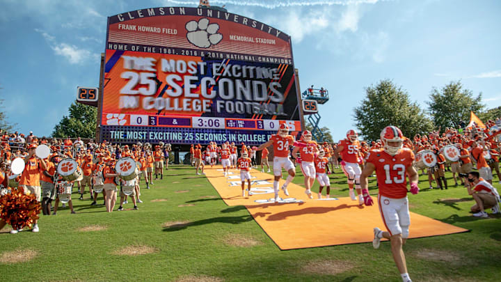 The Clemson football team runs down the hill, dubbed as the most exciting 25 seconds in college football, before the game against Syracuse in Clemson, South Carolina Saturday, Oct 24, 2020.