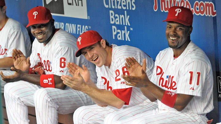August 10, 2012; Philadelphia, PA USA; Philadelphia Phillies first baseman Ryan Howard (6), second baseman Chase Utley (26) and shortstop Jimmy Rollins (11) applaud former Phillies teammate Mike Lieberthal (not pictured) who was inducted into the Phillies 'Wall of Fame' before the game against the St. Louis Cardinals during game at Citizens Bank Park. Mandatory Credit: Eric Hartline-Imagn Images