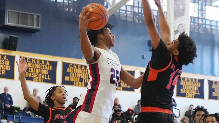 Stepinac's Jasiah Jervis (25) passes to a teammate against St. Raymond during CHSAA AA Archdiocesan championship game at Mount Saint Michael Academy in the Bronx Feb. 22, 2025.