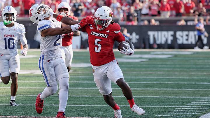 Keyjuan Brown stiff arms an SMU defender on his way to the endzone for a touchdown early in the second half. Keyjuan Brown stiff arms an SMU defender on his way to the endzone for a touchdown early in the second half.