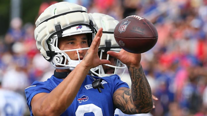 Bills defensive back Taylor Rapp pulls in a throw as he warms up.