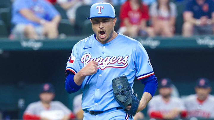Mar 30, 2025; Arlington, Texas, USA; Texas Rangers relief pitcher Luke Jackson (77) reacts after recording the last out against the Boston Red Sox at Globe Life Field.