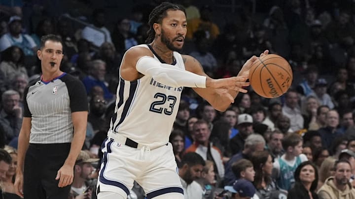 Feb 10, 2024; Charlotte, North Carolina, USA; Memphis Grizzlies guard Derrick Rose (23) passes during the second half against the Charlotte Hornets at Spectrum Center.
