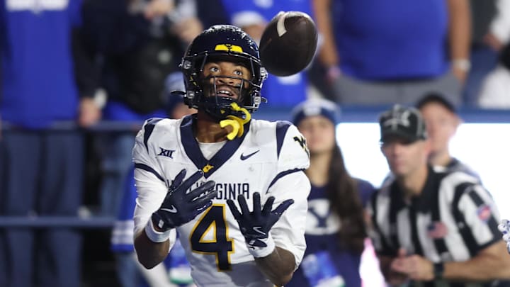 Oct 3, 2025; Provo, Utah, USA; West Virginia Mountaineers wide receiver Cam Vaughn (4) makes a catch for a touchdown against the Brigham Young Cougars during the fourth quarter at LaVell Edwards Stadium. Mandatory Credit: Rob Gray-Imagn Images