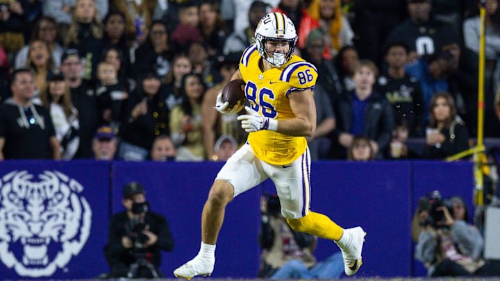 Nov 23, 2024; Baton Rouge, Louisiana, USA;  LLSU Tigers tight end Mason Taylor (86) runs after a catch against the Vanderbilt Commodores during the first half at Tiger Stadium. Mandatory Credit: Stephen Lew-Imagn Images