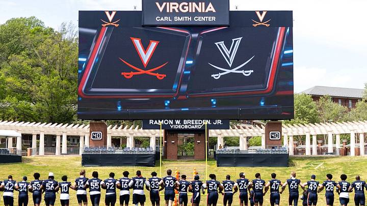 The Cavaliers walk, arm-in-arm before the 2026 spring game. The Cavaliers walk, arm-in-arm before the 2026 spring game.