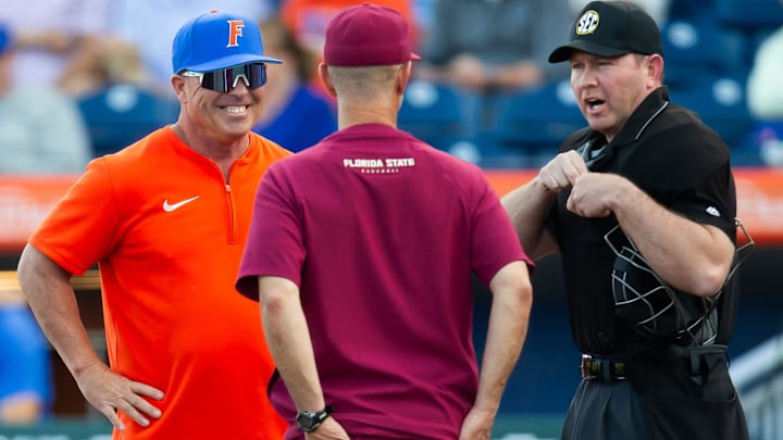 Florida Head Coach Kevin O'Sullivan talks with Florida State Head Coach Link Jarrett before the