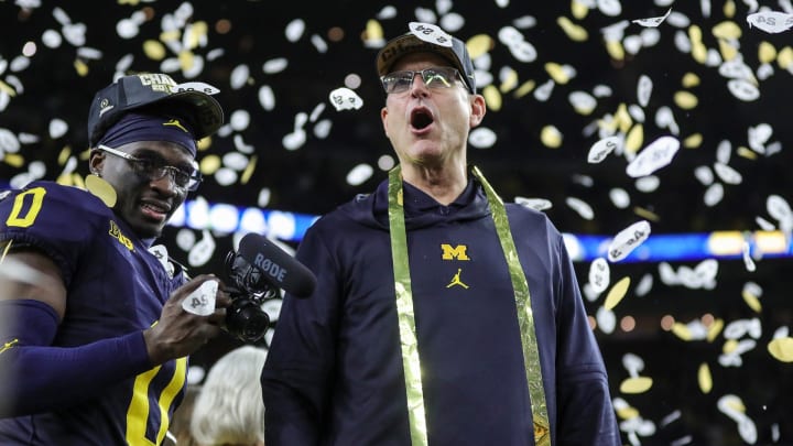 Michigan head coach Jim Harbaugh celebrates during the trophy presentation after the 34-13 win over Washington at the national championship game at NRG Stadium in Houston on Monday, Jan. 8, 2024. Michigan head coach Jim Harbaugh celebrates during the trophy presentation after the 34-13 win over Washington at the national championship game at NRG Stadium in Houston on Monday, Jan. 8, 2024.