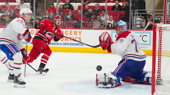 Mar 29, 2026; Raleigh, North Carolina, USA; Carolina Hurricanes center Sebastian Aho (20) misses on his shot attempt against Montreal Canadiens goaltender Jakub Dobes (75) during the third period at Lenovo Center. Mandatory Credit: James Guillory-Imagn Images Mar 29, 2026; Raleigh, North Carolina, USA; Carolina Hurricanes center Sebastian Aho (20) misses on his shot attempt against Montreal Canadiens goaltender Jakub Dobes (75) during the third period at Lenovo Center. Mandatory Credit: James Guillory-Imagn Images