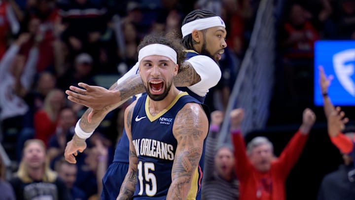  New Orleans Pelicans guard Jose Alvarado (15) celebrates a three point basket during the first half with New Orleans Pelicans forward Brandon Ingram (14) and his teammates on the bench against the Cleveland Cavaliers at Smoothie King Center. Mandatory Credit: Matthew Hinton-Imagn Images