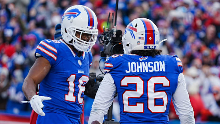 Buffalo Bills wide receiver Amari Cooper (18) celebrates with Buffalo Bills running back Ty Johnson (26) Johnson’s touchdown during the second half of the Buffalo Bills wild card game against the Denver Broncos at Highmark Stadium in Orchard Park on Jan. 12, 2025.