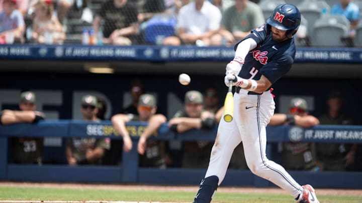 Ole Miss Rebels' Mitchell Sanford (4) hits the ball as Ole Miss Rebels take on Vanderbilt Commodores during the SEC baseball tournament championship game at Hoover Met in Birmingham, Ala., on Sunday, May 25, 2025. Vanderbilt Commodores defeated Ole Miss Rebels 3-2.
