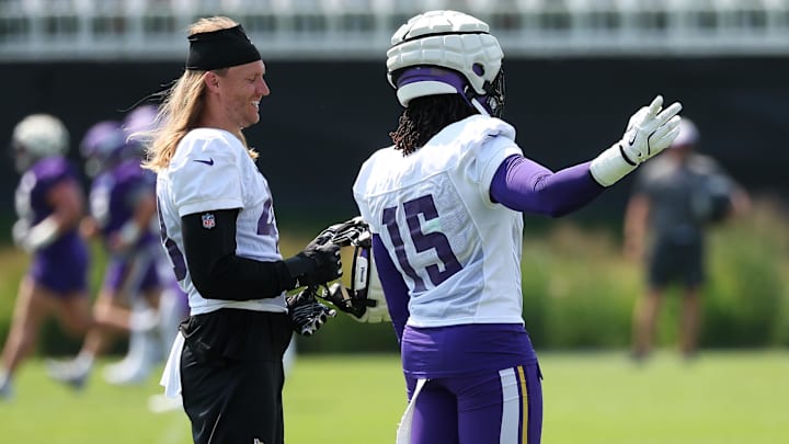 Jul 29, 2025; Eagan, MN, USA; Minnesota Vikings linebacker Andrew Van Ginkel (43) and linebacker Dallas Turner (15) talk during the team's training camp at the Minnesota Vikings Training Facility. 