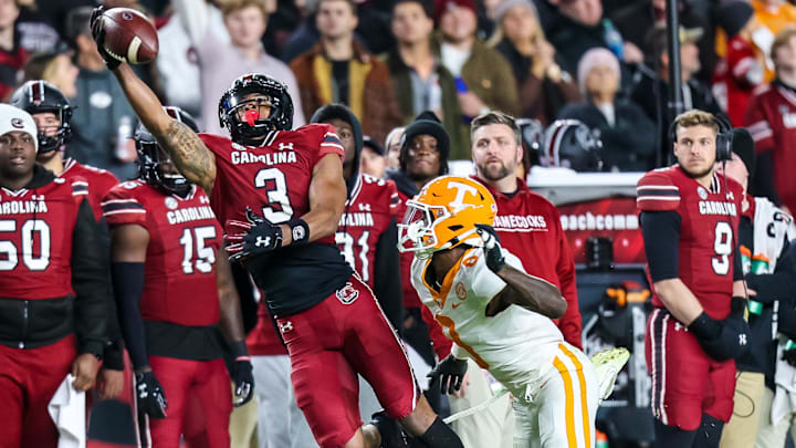 Nov 19, 2022; Columbia, South Carolina, USA; South Carolina Gamecocks wide receiver Antwane Wells Jr. (3) cannot come up with a reception against Tennessee Volunteers defensive back Brandon Turnage (8) in the second quarter at Williams-Brice Stadium. Mandatory Credit: Jeff Blake-Imagn Images