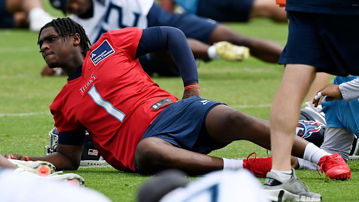 Tennessee Titans quarterback Cam Ward (1) stretches during an NFL football minicamp camp practice at Ascension Saint Thomas Sports Park Thursday, June 12, 2025, in Nashville, Tenn.