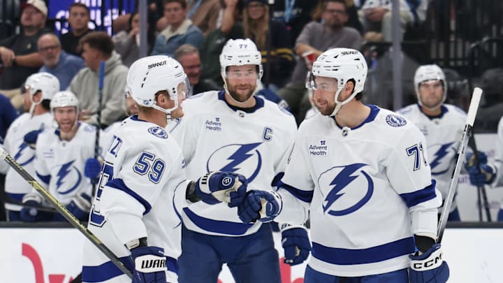 Nov 2, 2025; Salt Lake City, Utah, USA; Tampa Bay Lightning center Anthony Cirelli (71) celebrates scoring a goal against the Utah Mammoth during the second period with center Jake Guentzel (59) and defenseman Victor Hedman (77) at Delta Center. Mandatory Credit: Rob Gray-Imagn Images