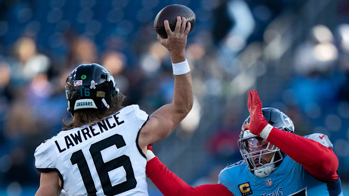 Tennessee defensive tackle Jeffery Simmons (98) hits the chest of Jacksonville quarterback Trevor Lawrence (16) to alter his third-down throw during their game at Nissan Stadium Sunday, Nov. 30, 2025. Jacksonville was forced to punt.