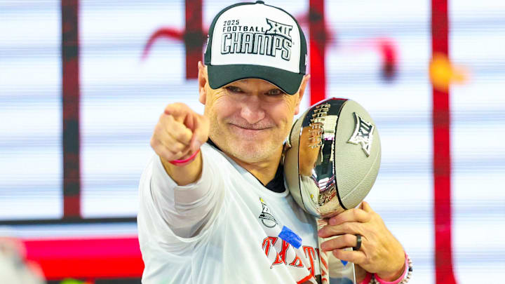 Dec 6, 2025; Arlington, TX, USA; Texas Tech Red Raiders head coach Joey McGuire celebrates with the Big 12 Championship trophy after the game against the BYU Cougars at AT&T Stadium. Mandatory Credit: Kevin Jairaj-Imagn Images