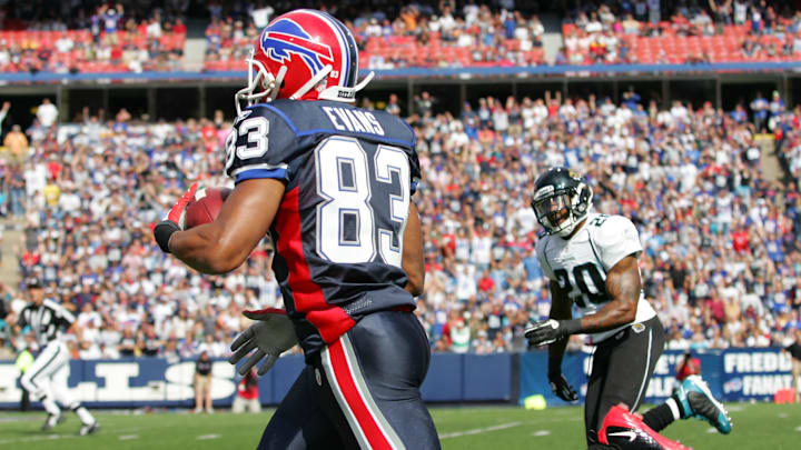 Oct 10, 2010; Orchard Park, NY, USA; Buffalo Bills wide receiver Lee Evans (83) runs past Jacksonville Jaguars safety Anthony Smith (20) to score a touchdown in the first quarter at Ralph Wilson Stadium. Mandatory Credit: Kevin Hoffman-Imagn Images