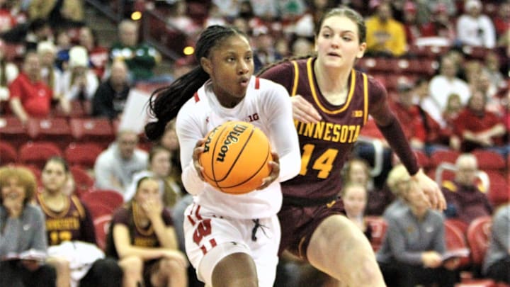 Wisconsin freshman guard Ronnie Porter drives past Minnesota's Isabelle Gradwell at the Kohl Cente Wisconsin freshman guard Ronnie Porter drives past Minnesota's Isabelle Gradwell at the Kohl Cente