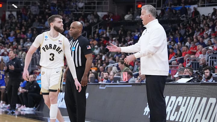Purdue Boilermakers head coach Matt Painter talks to guard Braden Smith (3) 