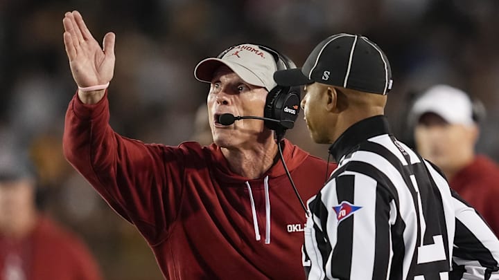 Nov 9, 2024; Columbia, Missouri, USA; Oklahoma Sooners head coach Brent Venables talks with line judge Jeremiah Harris during the first half against the Missouri Tigers at Faurot Field at Memorial Stadium. Nov 9, 2024; Columbia, Missouri, USA; Oklahoma Sooners head coach Brent Venables talks with line judge Jeremiah Harris during the first half against the Missouri Tigers at Faurot Field at Memorial Stadium.