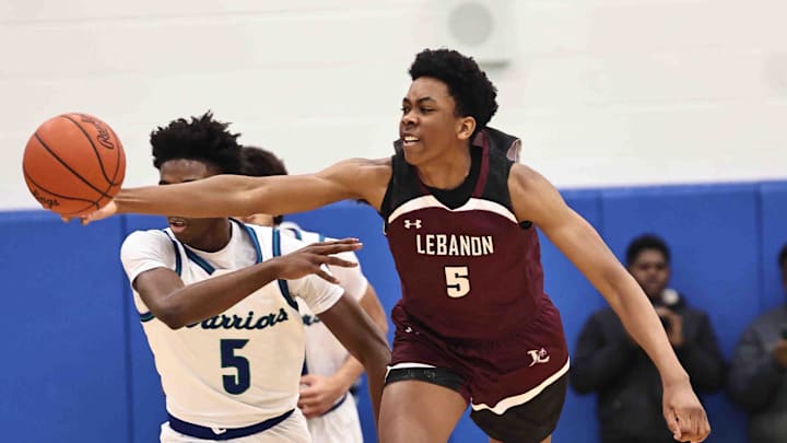 Lebanon forward Anthony Thompson (5) battles Winton Woods guard Nate Dawson (5) for a loose ball during their 50-61 loss Friday, Jan. 5, 2024.
