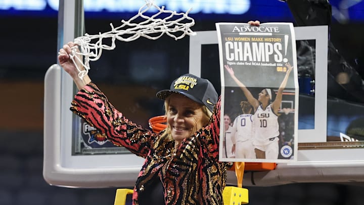 Apr 2, 2023; Dallas, TX, USA; LSU Lady Tigers head coach Kim Mulkey reacts while cutting down a piece of the net after defeating the Iowa Hawkeyes during the final round of the Women's Final Four NCAA tournament at the American Airlines Center. Mandatory Credit: Kevin Jairaj-Imagn Images Apr 2, 2023; Dallas, TX, USA; LSU Lady Tigers head coach Kim Mulkey reacts while cutting down a piece of the net after defeating the Iowa Hawkeyes during the final round of the Women's Final Four NCAA tournament at the American Airlines Center. Mandatory Credit: Kevin Jairaj-Imagn Images